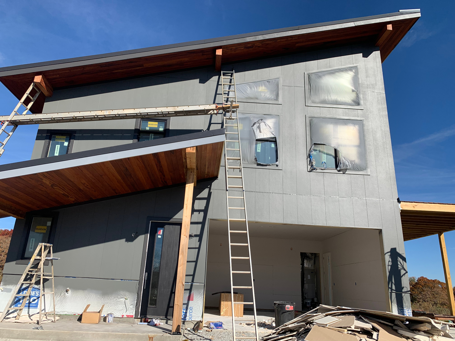 Detail of porch columns and railing on the completed custom residence